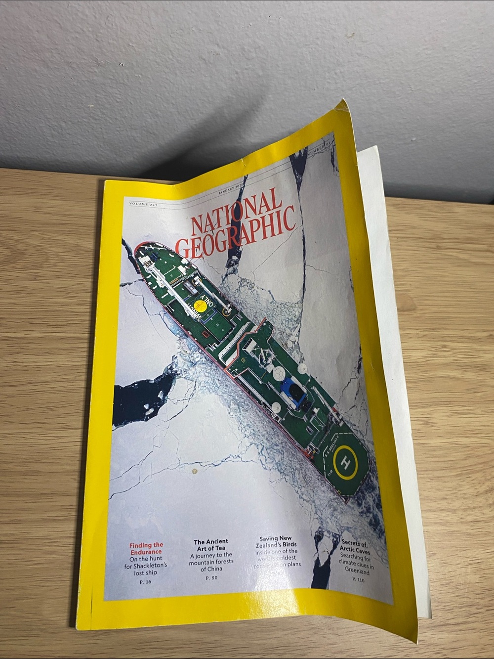 National Geographic Cover with Yellow Border and Green Ship Illustration
